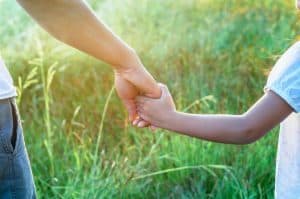 Boy and Girl Holding Hands In The Park