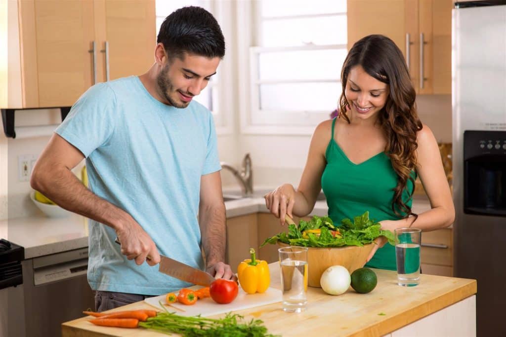 Husband and Wife Making A Dinner Salad