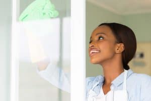 woman cleaning the glass